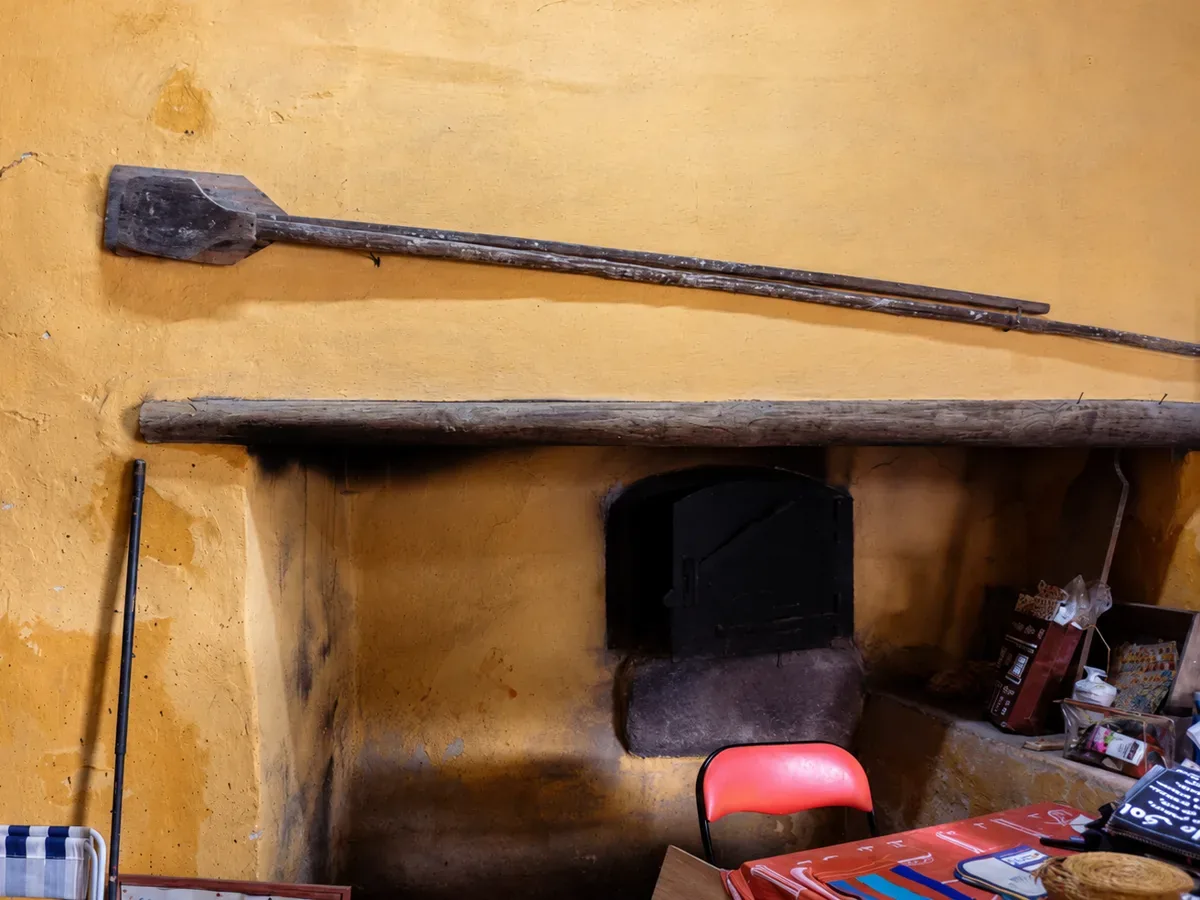 The restored community bread oven of Ti Bia Gadelha, with its wooden peels on the wall