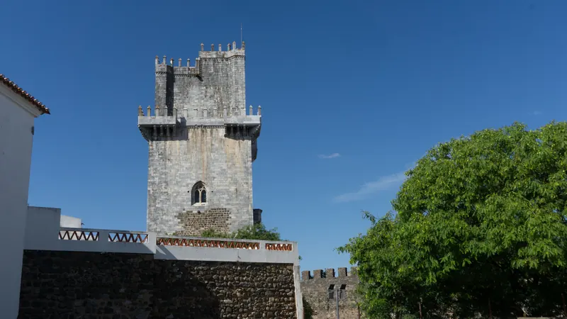 The Torre de Menagem of Beja castle against a blue sky